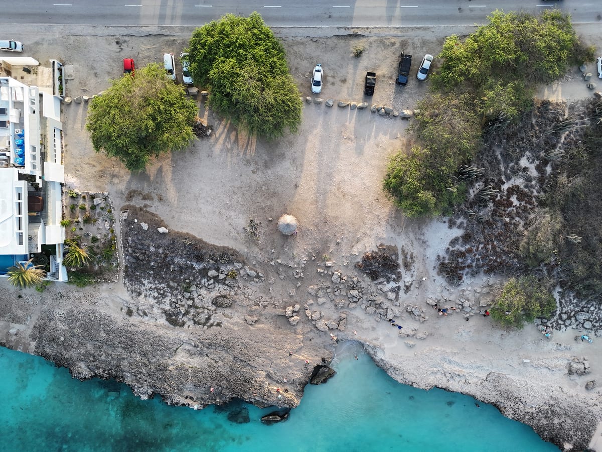 Original aerial photograph of the Tres Trapi roadside and former interior parking pull-in blocked with large rocks